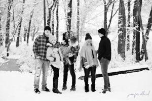 black and white photo of family in the snow