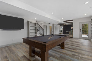 Bright Basement Area with Pool Table and TV