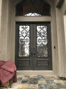 before photo of front door with iron design