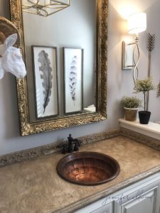 cement counter top in bathroom with a copper sink