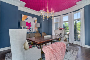 glamorous dining room with pink accents
