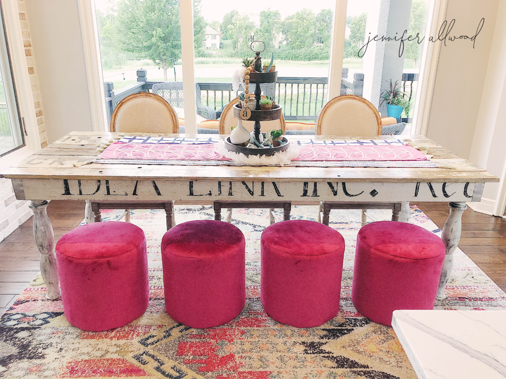 four hot pink stools and farmhouse table