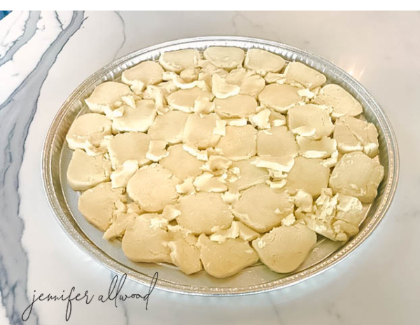 dough in pieces on round cookie sheet